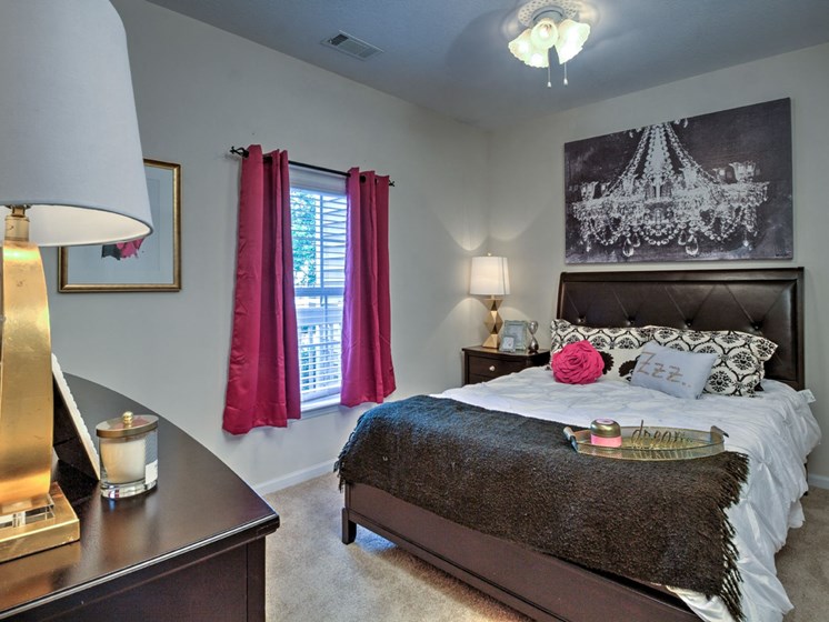 Wood-look flooring extends to bedrooms in select homes at Abberly Woods Apartment Homes by HHHunt, Charlotte, 28216
